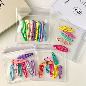Colorful polka dot snap hair clips set in transparent pouches for girls