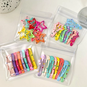 Polka dot star and teardrop BB hair clips set in transparent packaging for girls
