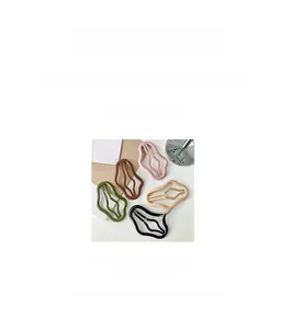 Detail view of wavy resin hair clips in candy colors measuring 6.8cm by 4.4cm size