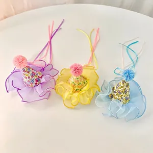 Three colorful floral mini party hat hair clips with mesh trim and soft pom-poms