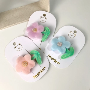 Three-piece floral mesh hair clips for girls in pink, purple, and blue on display card