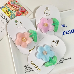Three colorful mesh flower hair clips for girls with embroidery leaves on display