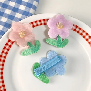 Charming floral hair clips set for girls featuring fabric petals and sparkling sequins