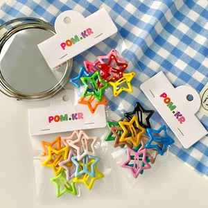 Colorful pentagram star hair clips set in vibrant shades on a blue plaid background
