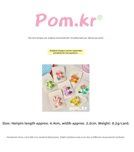 Detailed view showing cartoon hair clips with dimensions of 4.4 cm length and 2.2 cm width