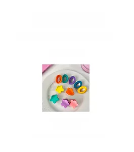 Close-up of matte macaron colored star hair clips on white ceramic plate, 3cm size