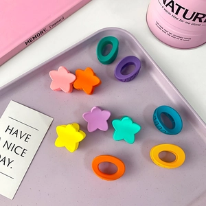 Set of 10 colorful matte star and oval hair claws for girls in vibrant candy colors