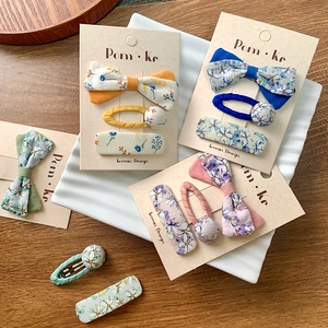 Floral bow hair clips set for girls featuring colorful patterns in Korean style