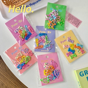 Colorful polka dot hair clips set with star and heart shapes on display cards