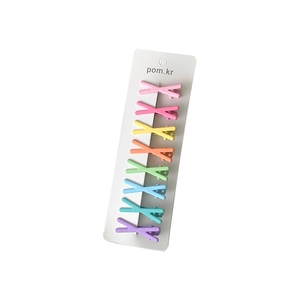 Set of 8 colorful X-shaped macaron hair clips for girls on a white display card