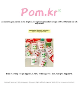 Detailed view of Christmas hair clips with dimensions showing 5.7cm length and 2cm width