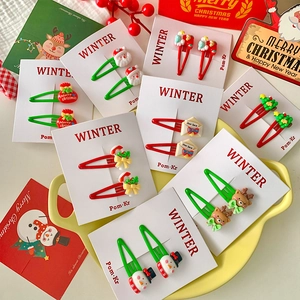 Christmas water drop hair clips set with Santa and reindeer motifs on white cardboards