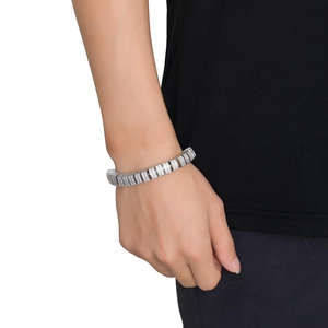 Silver cuban link bracelet for men with micro-paved zircons shown on wrist on black background