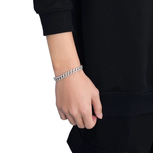 Close-up of 9mm silver Cuban link necklace with micro-paved cubic zirconia on a male model