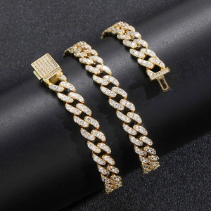 Detailed macro view of 9mm golden Cuban link necklace with micro-paved cubic zirconia stones