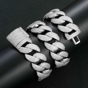 Macro shot of 22mm wide Cuban link chain with 5 rows of shimmering white zircons