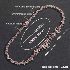 Detail of spiked thorn necklace featuring rhodium-plated brass and red cubic zirconia stones