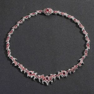 Gothic hip hop dragon wing necklace with red crystals and silver metal spikes