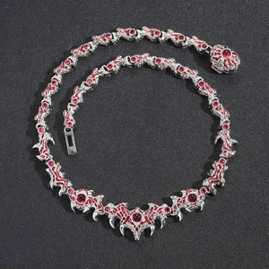 Gothic hip hop silver necklace featuring demonic spikes and red crystal parasite eye stones