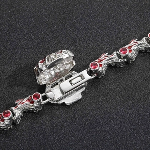 Macro detail of silver hip hop bracelet featuring red zircon stones and secure box clasp