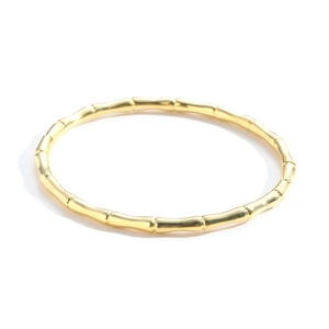 Minimalist gold plated bamboo joint bangle with realistic segment texture on white background