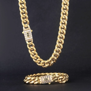 Ensemble collier et bracelet maille cubaine dorée avec fermoir pavé de zircons