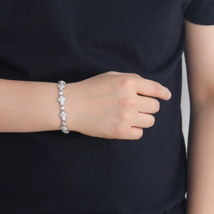 Hip hop 10mm cross linked bracelet with pavé cubic zirconia worn on a model's wrist