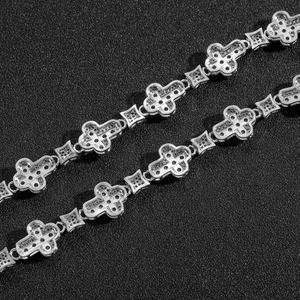 Macro detail of S925 sterling silver stamp on cross flower bracelet with cubic zirconia