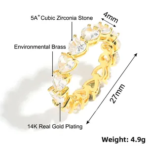 Detailed view of heart-shaped ring band with pink cubic zirconia in 14K gold plating