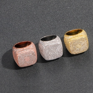 Detail view of hip-hop square rings with pave-set cubic zirconia in gold and silver