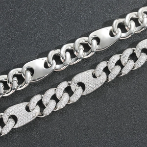 Detail view of 15mm Cuban link chains with polished metal and micro-paved zircon stones