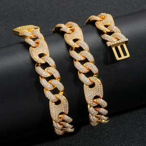 Close-up of gold iced-out 15mm bubble Cuban chain necklace with sparkling zircon inlays