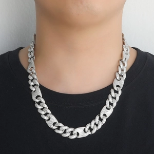 Detailed close-up of hip hop cuban link necklace with iced out pave-set zircons