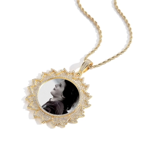 Detailed view of custom sunburst photo pendant with gold plating and cubic zirconia stones