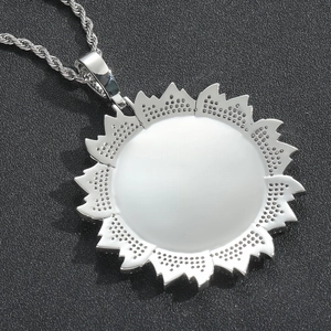 Macro view of silver sunflower pendant with a customizable circular mirror finish