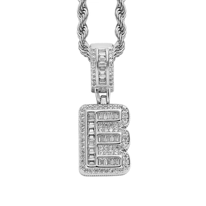 Close-up of hip hop silver letter E pendant with square cubic zirconia and rope chain