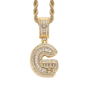 Close-up of hip hop pendant with letter G and micro-paved cubic zirconia stones