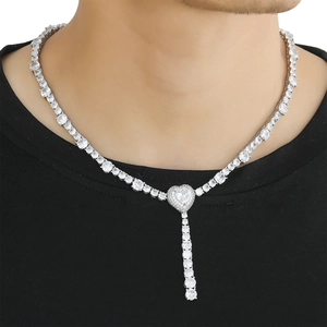 Hip hop tennis chain necklace with heart pendant and pavé zircons worn by a model
