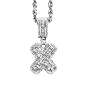 Macro detail of silver hip hop X-letter pendant with square zircons and rope chain
