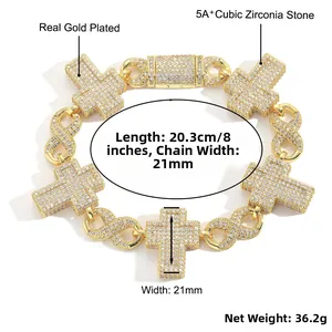 Macro view of iced out Cuban link bracelet featuring cross and infinity links with zircons