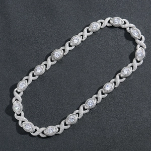 Macro shot of silver hip hop Cuban chain with X-shape links and marquise stones