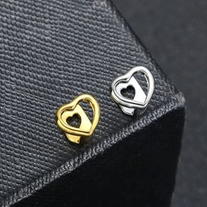 Bijou dentaire en forme de cœur évidé, finitions or et argent, idéal pour le cosplay