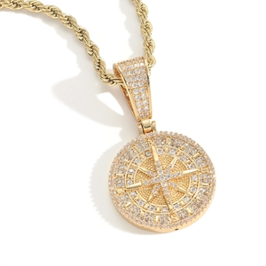 Gold compass pendant necklace with shimmering zircon stones and elegant rope chain