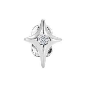Macro detail of silver star-shaped tooth jewelry with sparkling zircon stone inlay