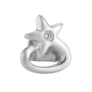 Macro detail of a silver star-shaped tooth accessory with sparkling zircon stones