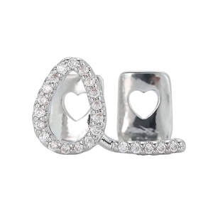 Silver hip hop grillz set with zircon-paved pear shape and heart cutout design