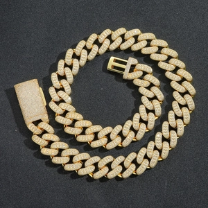 Close-up of 20mm golden Cuban link chain featuring micro-paved square zircon stones