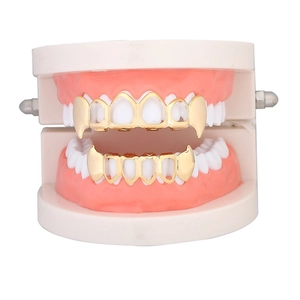 Gold-plated hip hop grillz set featuring vampire fangs style for Halloween costumes