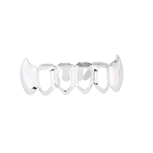 Close-up of hip hop silver plated hollow grillz set with sharp canine teeth for party wear