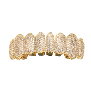 Close-up of gold hip hop grillz with micro-paved cubic zirconia for eight teeth